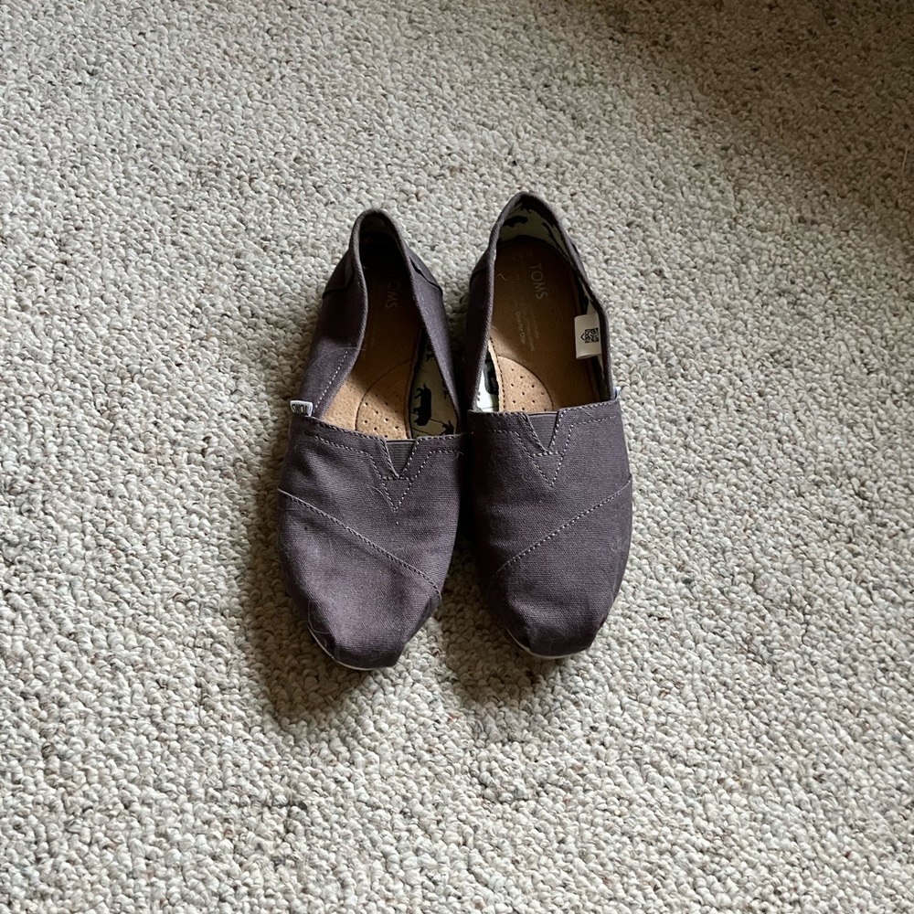 Tom’s slip ons.